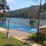 Completed lakeside swimming pool with water features